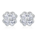 Close-up of women's 925 silver earrings with a four-leaf clover and heart design, inlaid with zircon stones in white gold colour.