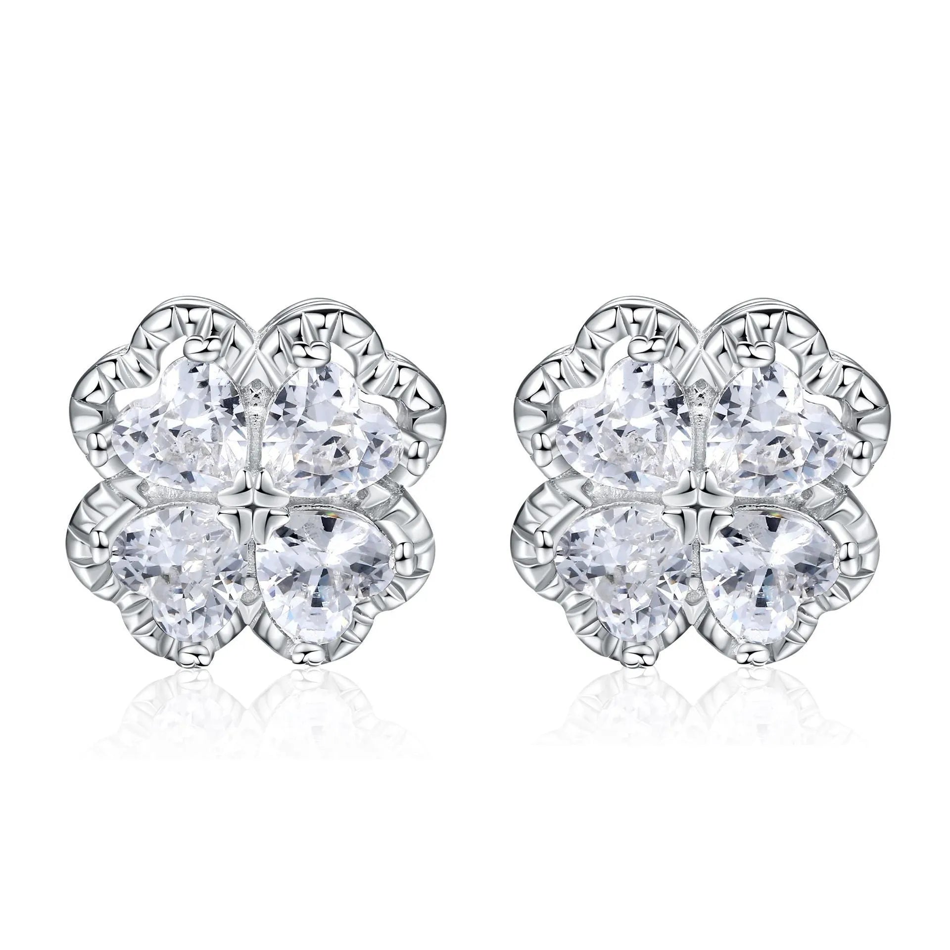 Close-up of women's 925 silver earrings with a four-leaf clover and heart design, inlaid with zircon stones in white gold colour.