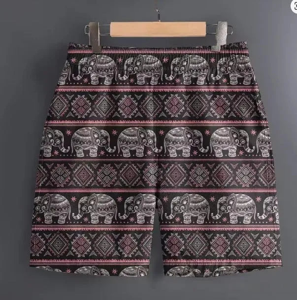 Men's casual polyester sports shorts in a camouflage print pattern, laid flat.