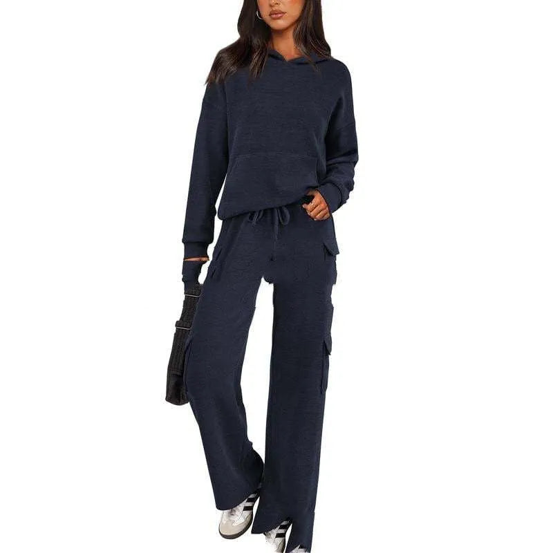 Women's two-piece polyester leisure suit in a solid colour, showing long sleeves and full-length trousers.