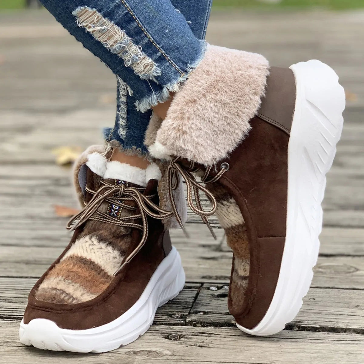 Women's beige lace-up suede snow boots with thermal lining and a thick rubber sole.