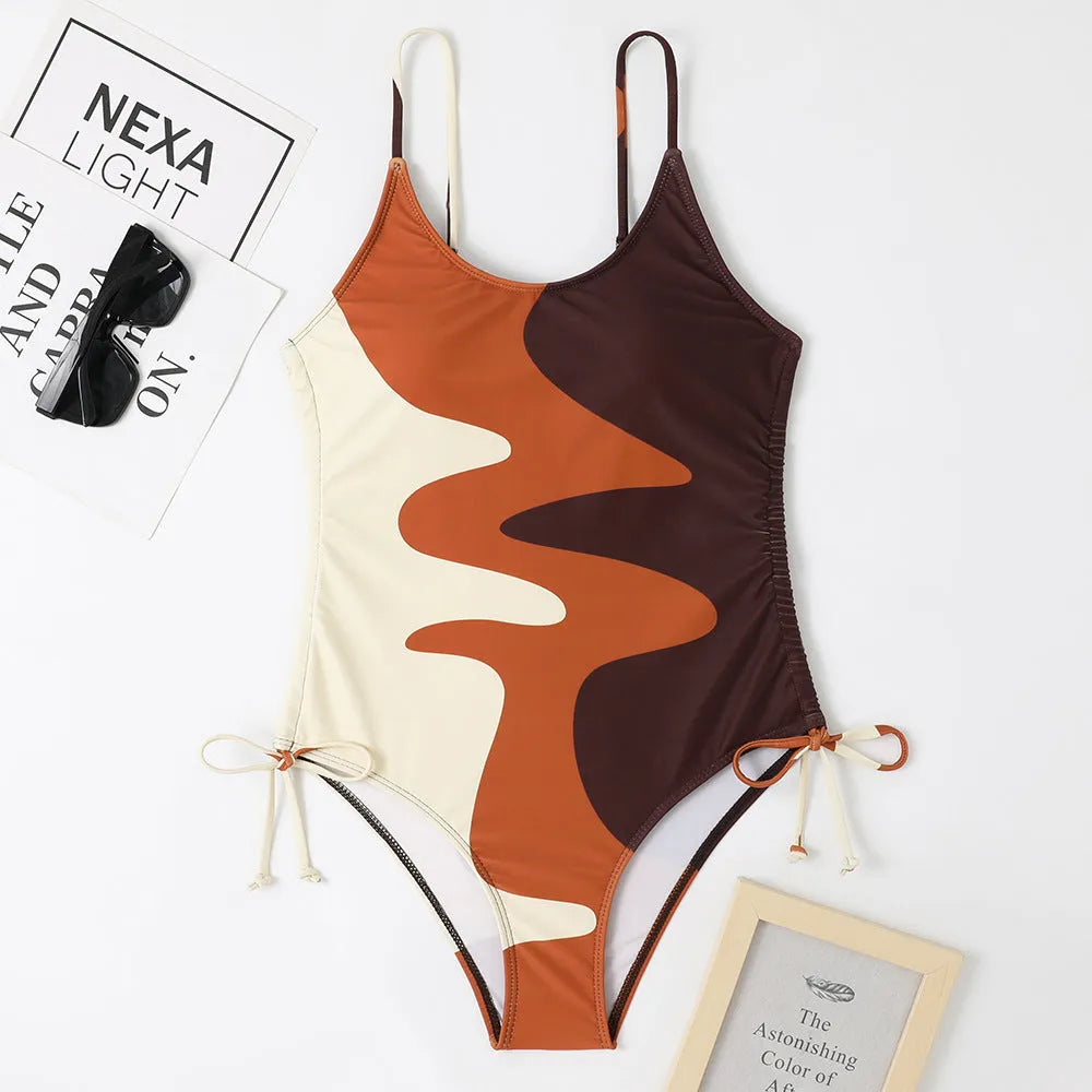 Women's sleeveless backless one-piece swimsuit in blue, shown in a solid colour style.