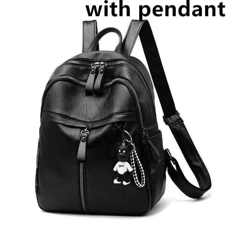 Black soft surface PU leather backpack with double straps showing ID compartment and zipper opening