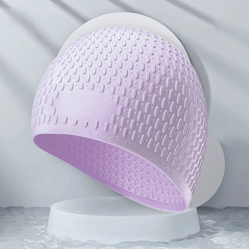 Silicone adult swimming cap with water drop texture in solid colour options on white background.