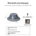 Beige wine bottle-shaped camping lantern showing three light mode settings and USB-C charging port.