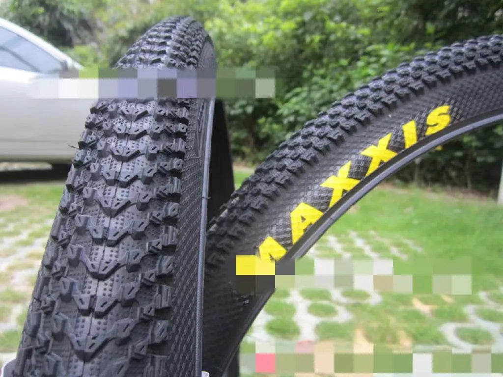 Ultralight puncture-proof mountain bike tyre shown in black with aggressive tread pattern.