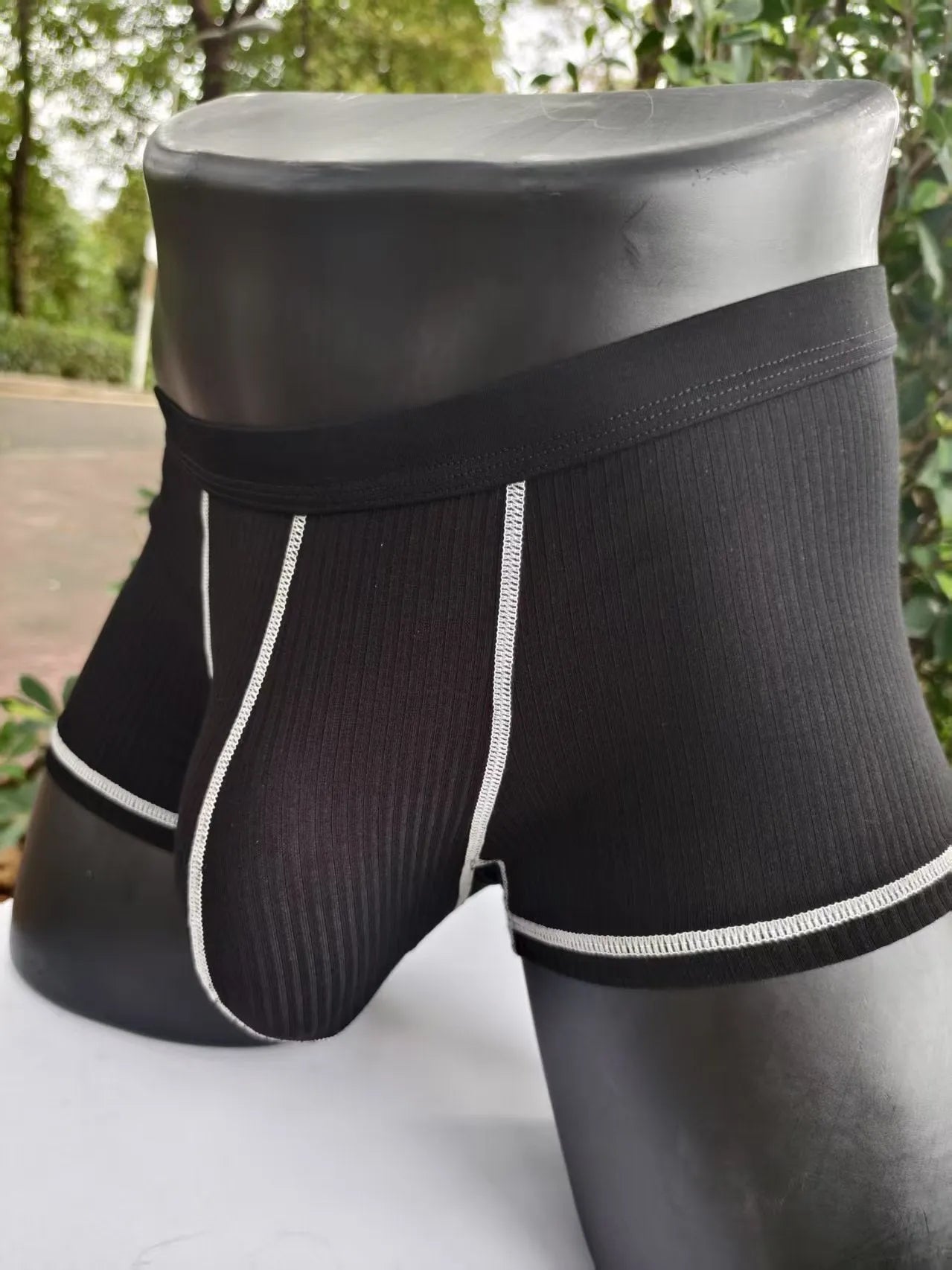 Men's breathable boxers in Army Green solid colour showing thin fabric construction and body shaping design