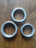 Wing Chun carbon steel training ring in three sizes for martial arts strength conditioning.