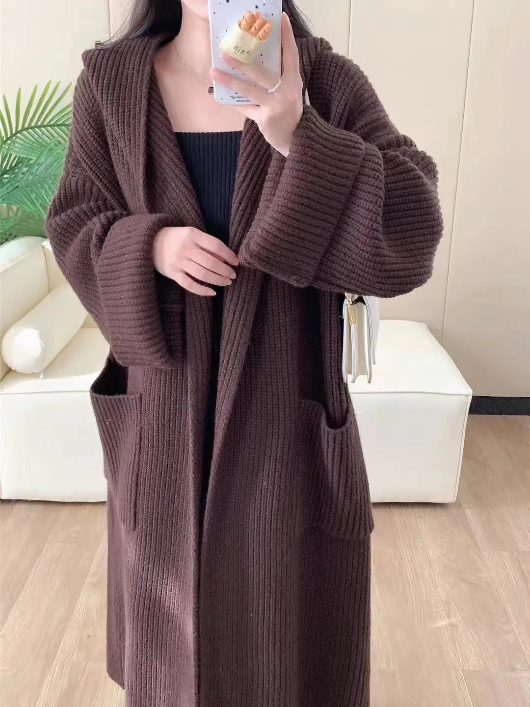 Women's loose hooded cardigan coat in beige with raglan sleeves and extended length