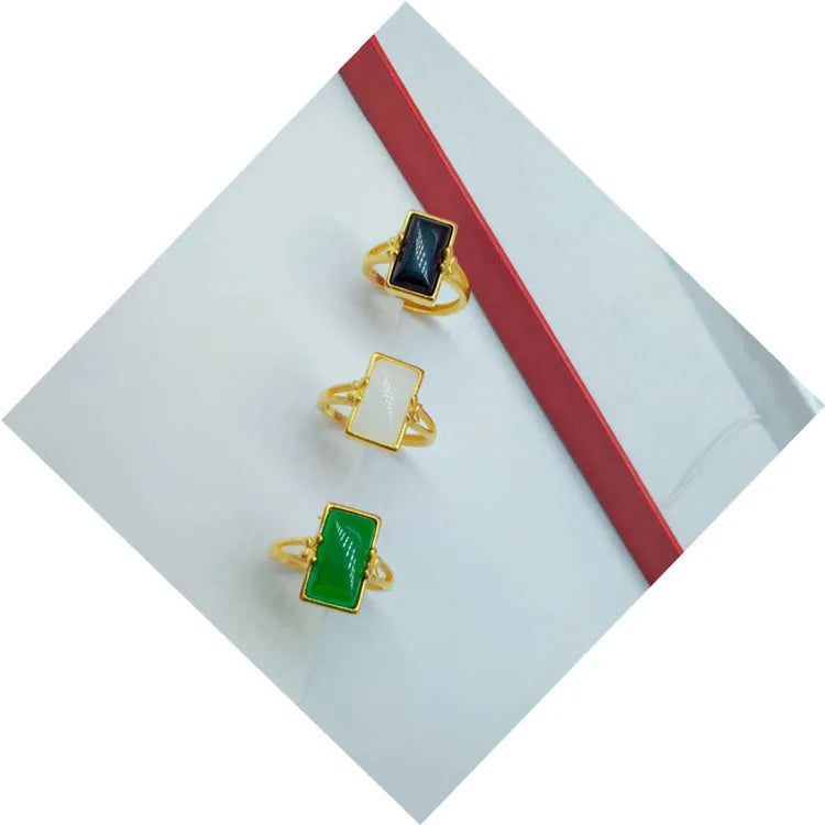 Adjustable brass gold-plated ring with artificial gemstones in black, green and white colour options