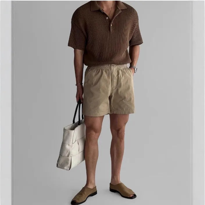Cotton sports shorts in loose fitting design available in black, white and khaki colours