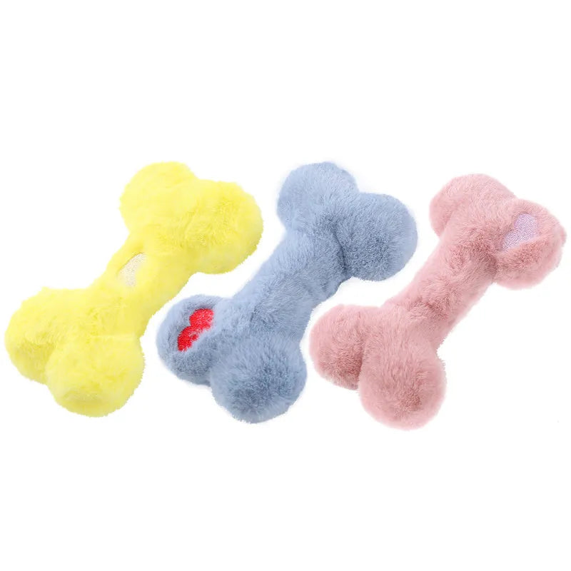 Blue plush love bone dog toy with a squeaker, shown next to pink and yellow versions.
