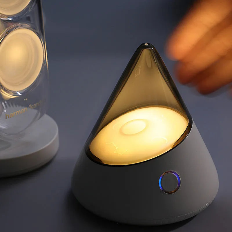 M3 small night lamp in colourful blue with geometric stereo design on a table