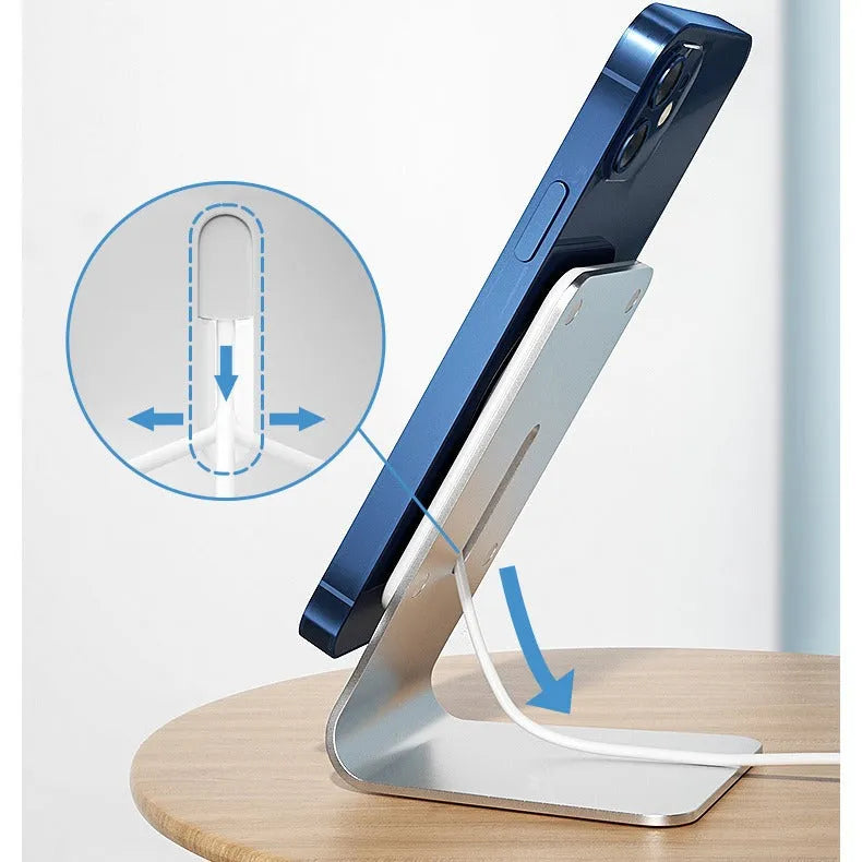 Silver aluminium alloy wireless charging stand holding a phone upright on a desk