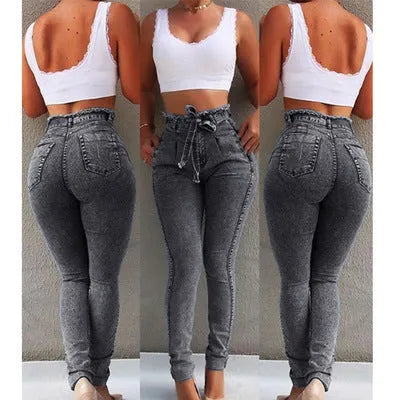 Pair of women's light blue straight-leg jeans with a frayed, distressed hem detail.