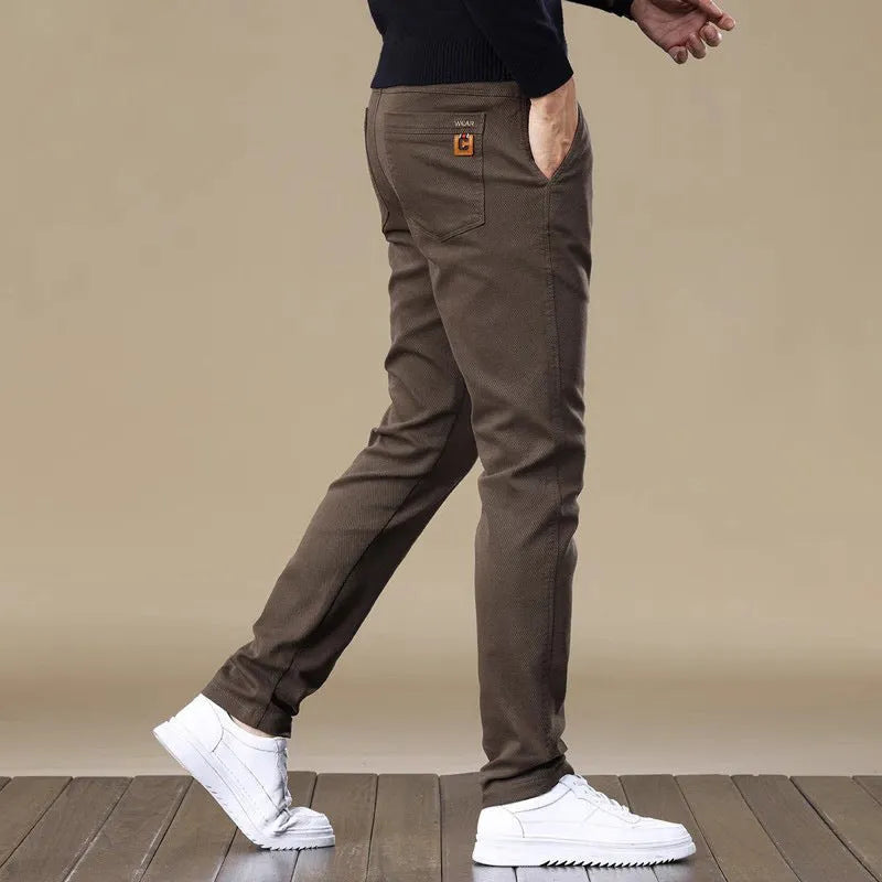 Men's fleece-lined slim fit tapered casual cotton trousers in black, shown flat for detail