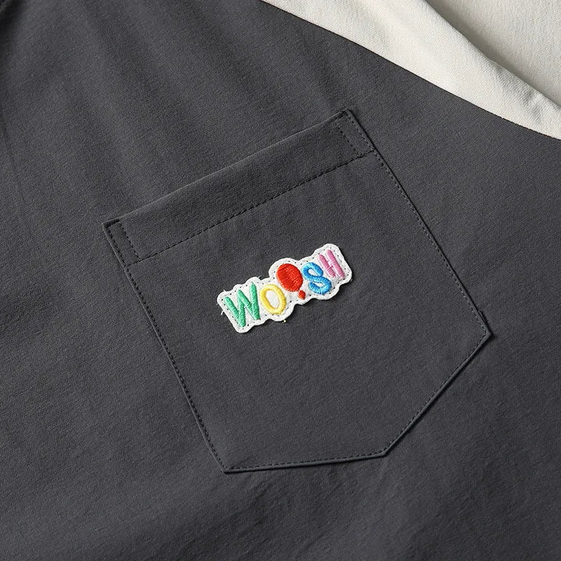 Dark grey men's loose fit t-shirt with contrasting colour panels on the raglan sleeves.