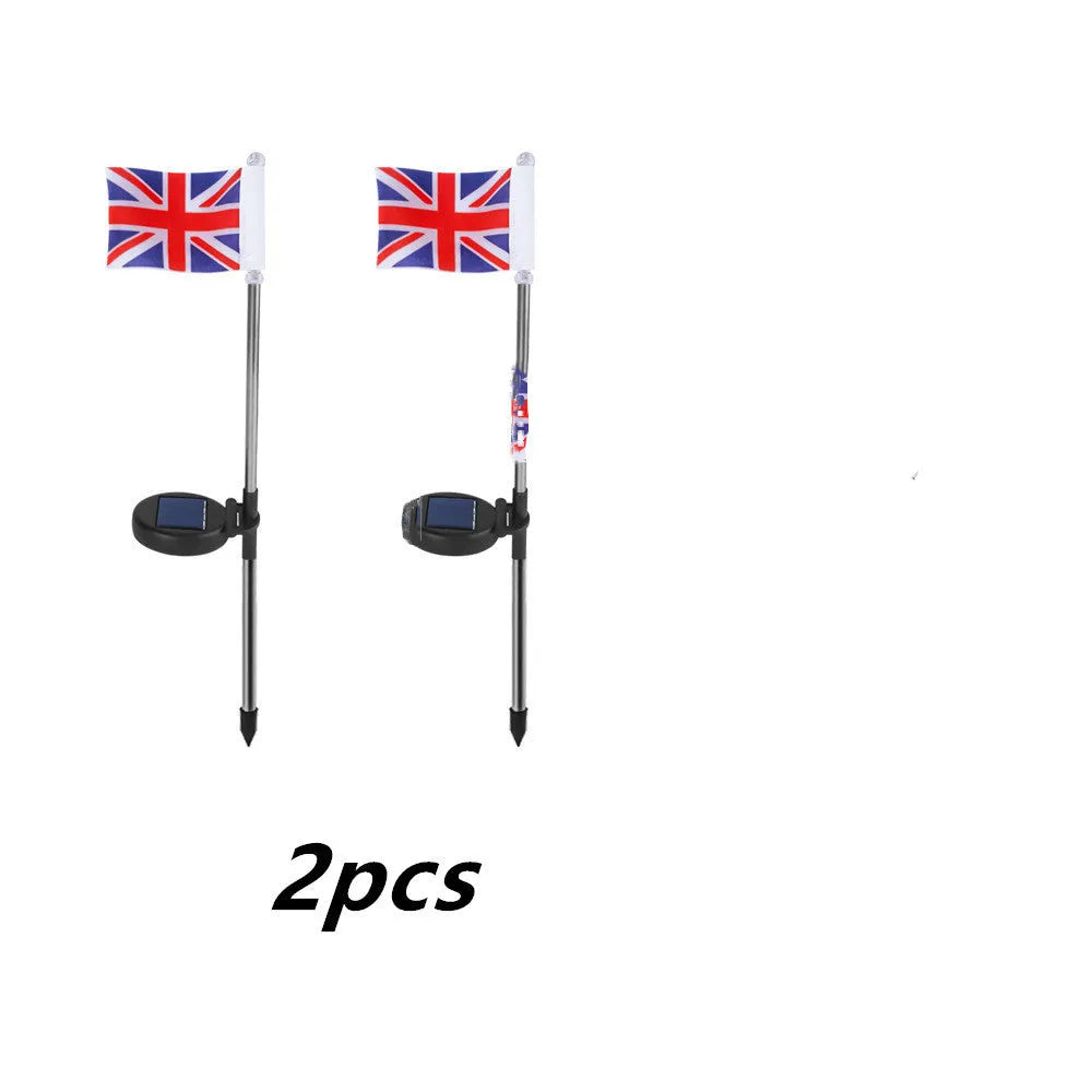 Solar garden flag light with stainless steel pole showing American flag design illuminated at night