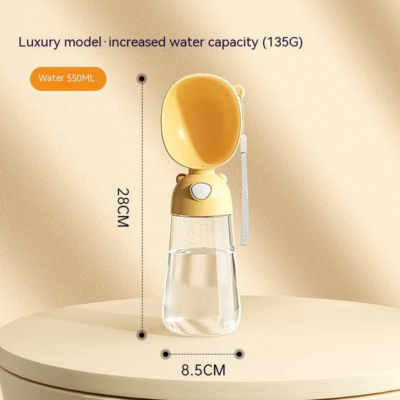 Portable dog water bottle with an attached feeding bowl in yellow, for outdoor travel.