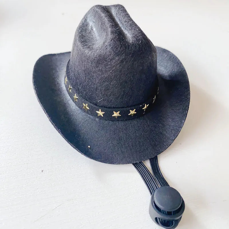British cowboy-style hat for a cat on a mannequin head, showing brown colour with a black ribbon trim.