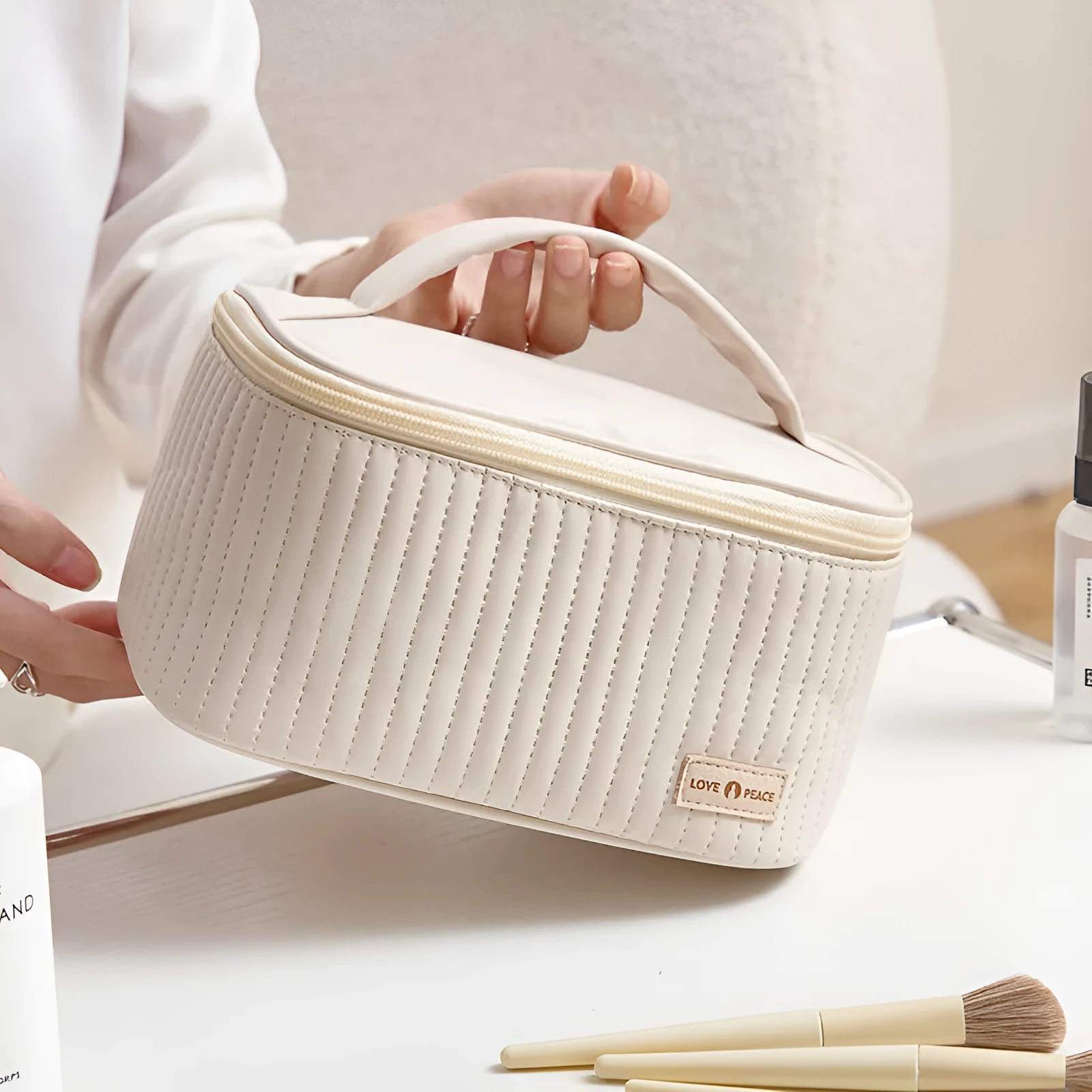 Open-top makeup bag in PU leather showing six colour options including pink, coffee, and light blue