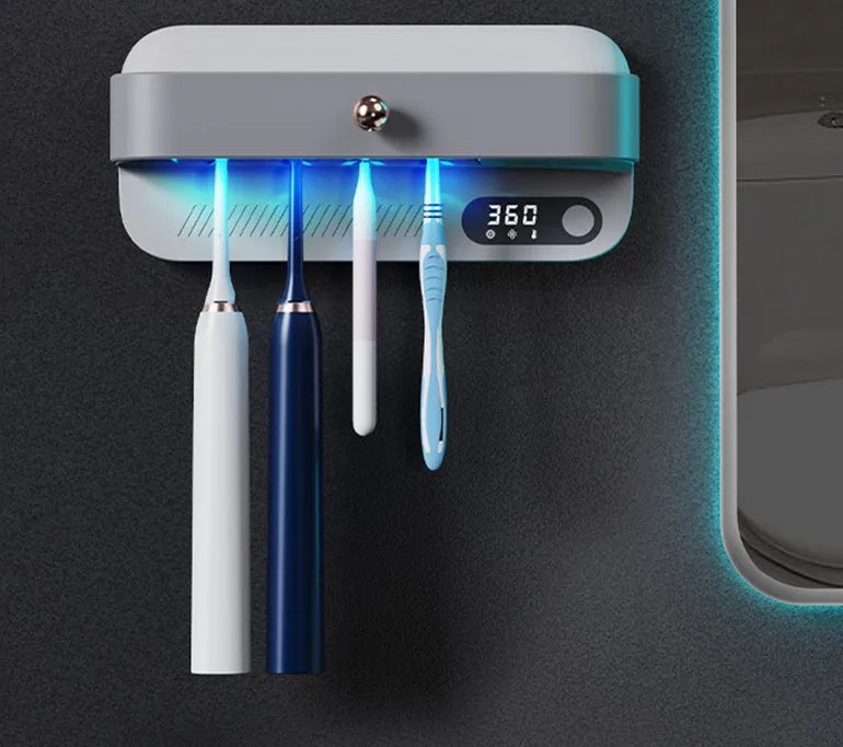 White smart wall-mounted toothbrush steriliser holder with UV light and USB charging port.