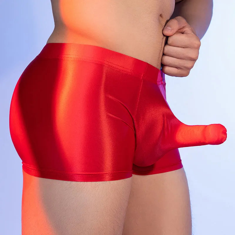 Men's red nylon boxer shorts with mid waist and seamless design on a white background.
