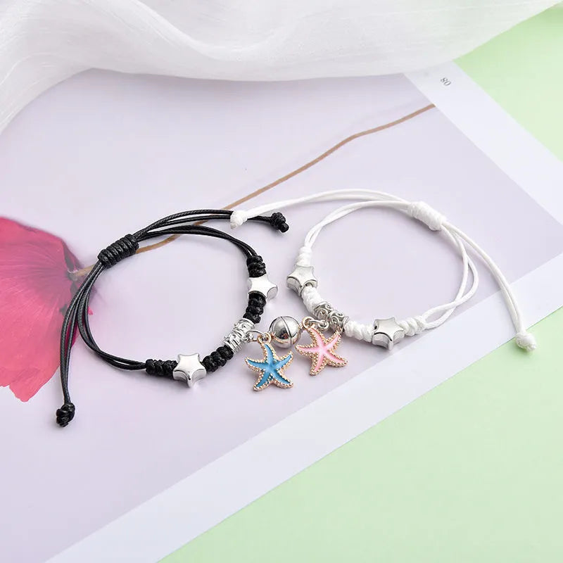 Magnetic couple bracelets with crown and diamond designs in alloy electroplated construction