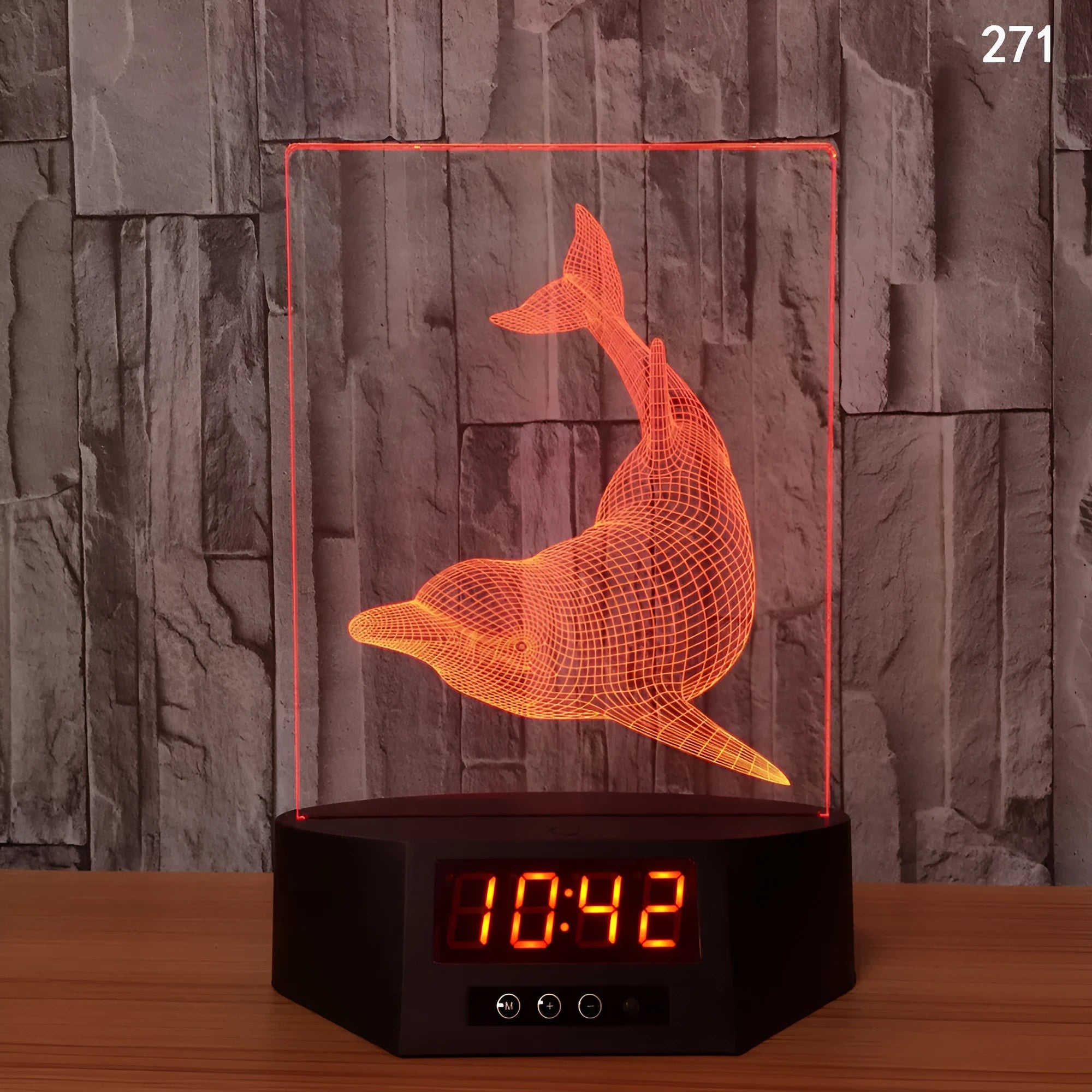 3D glowing dolphin night light with wireless charging and remote control on table