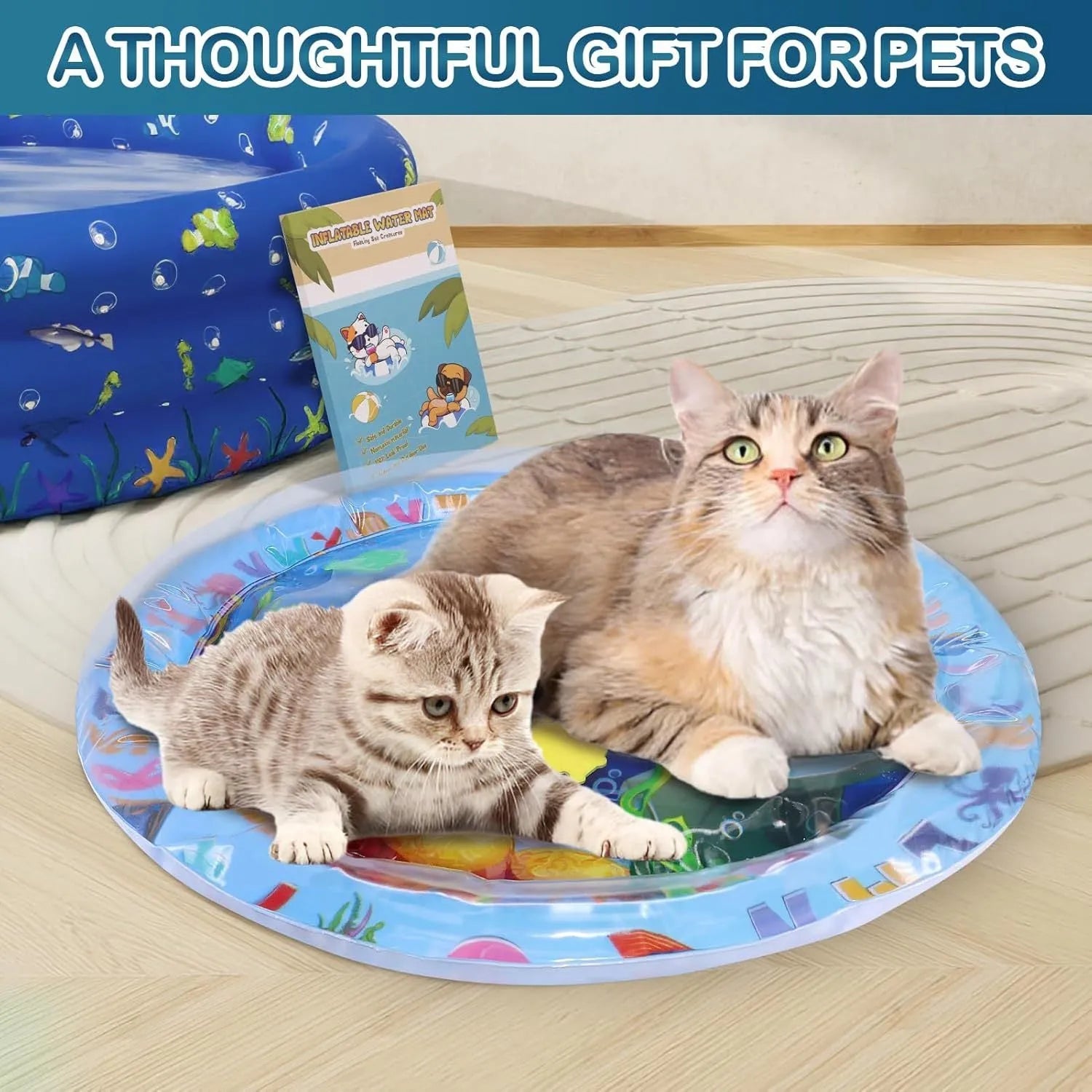 Square blue water sensory playmat for cats on floor, showing ocean fish design and floating toys inside.