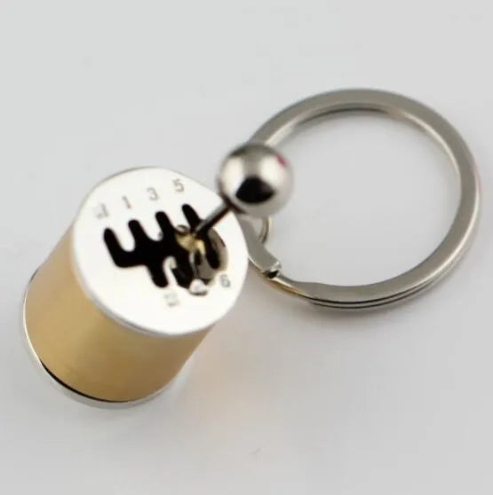 Polished metal gear shift keychain in black showing 6-speed and reverse gear positions