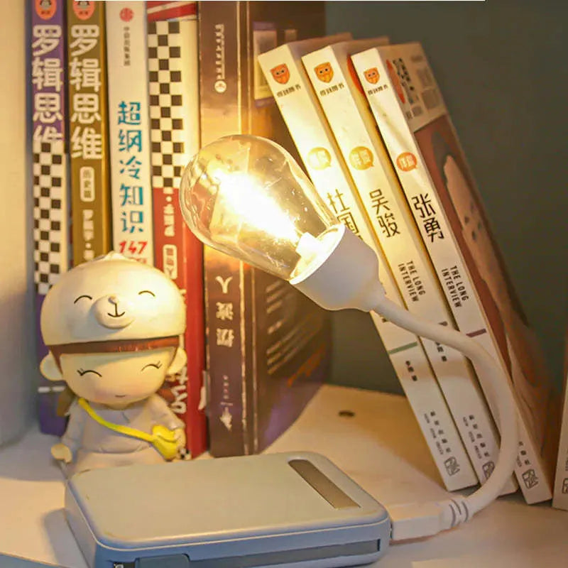 USB rechargeable folding night light with tungsten filament bulb in compact folded position