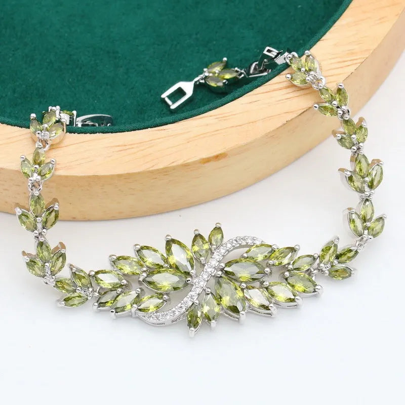 Retro botanical pattern jewellery set in copper alloy with zircon stones, showing necklace, bracelet, earrings, and ring.