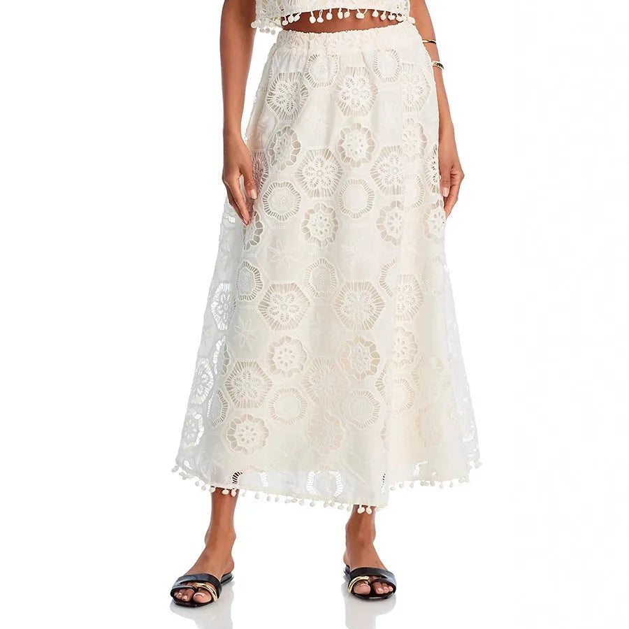 White women's sleeveless top and long skirt suit with retro embroidery detailing