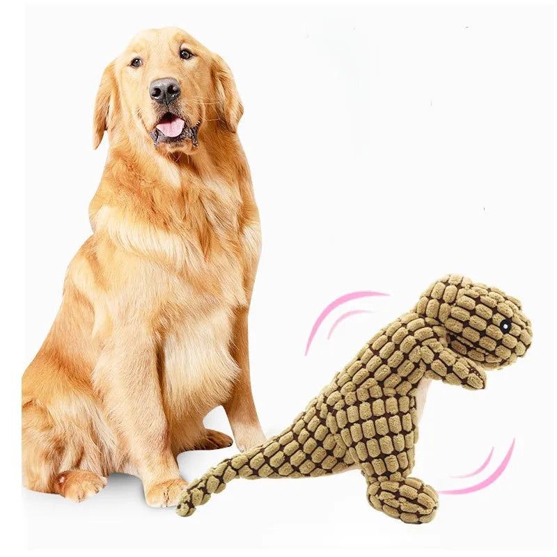 Grey, green, and orange coloured dog chew toy with sound, shown with size scale.