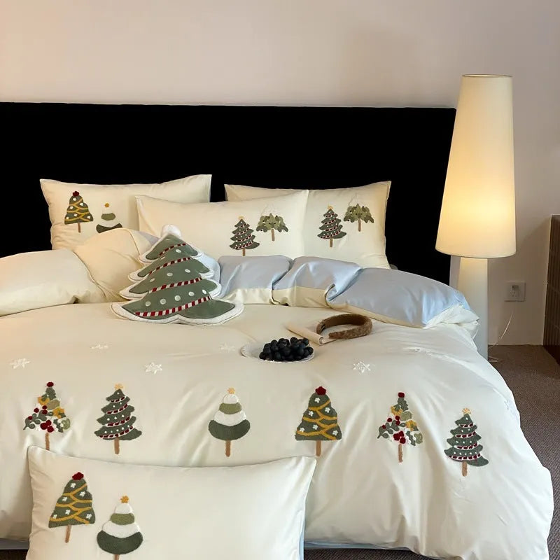 Pure cotton duvet cover set with embroidered Christmas trees and flowers, shown in cream blue colour.