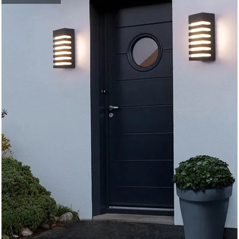 Modern minimalist outdoor wall lamp with aluminium alloy shell, shown in a grey finish mounted on a wall.