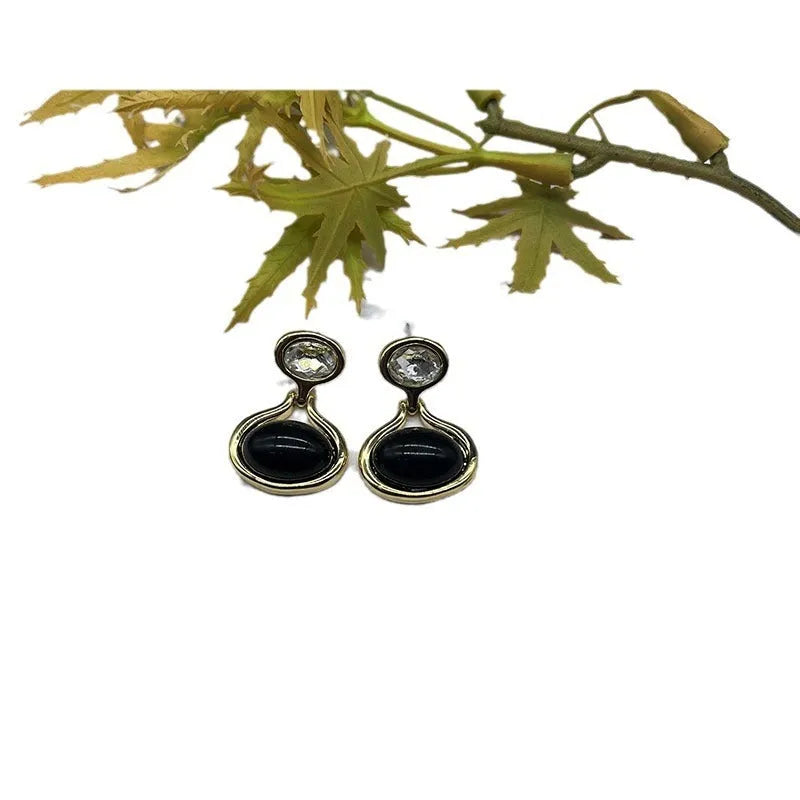 Black and gold geometric round oval alloy earrings with electroplated finish