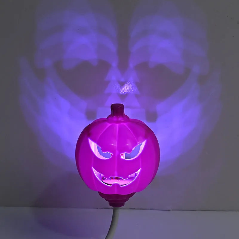 Plastic pumpkin-shaped lamp with USB charging cable, showing purple light option.
