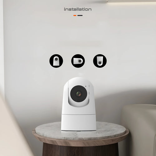 White indoor security camera with pan/tilt base on a shelf, showing wall mount screws.
