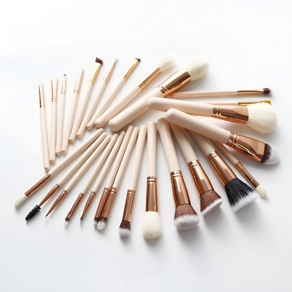 26 pink wooden handle makeup brushes arranged in a pink PU zip case.