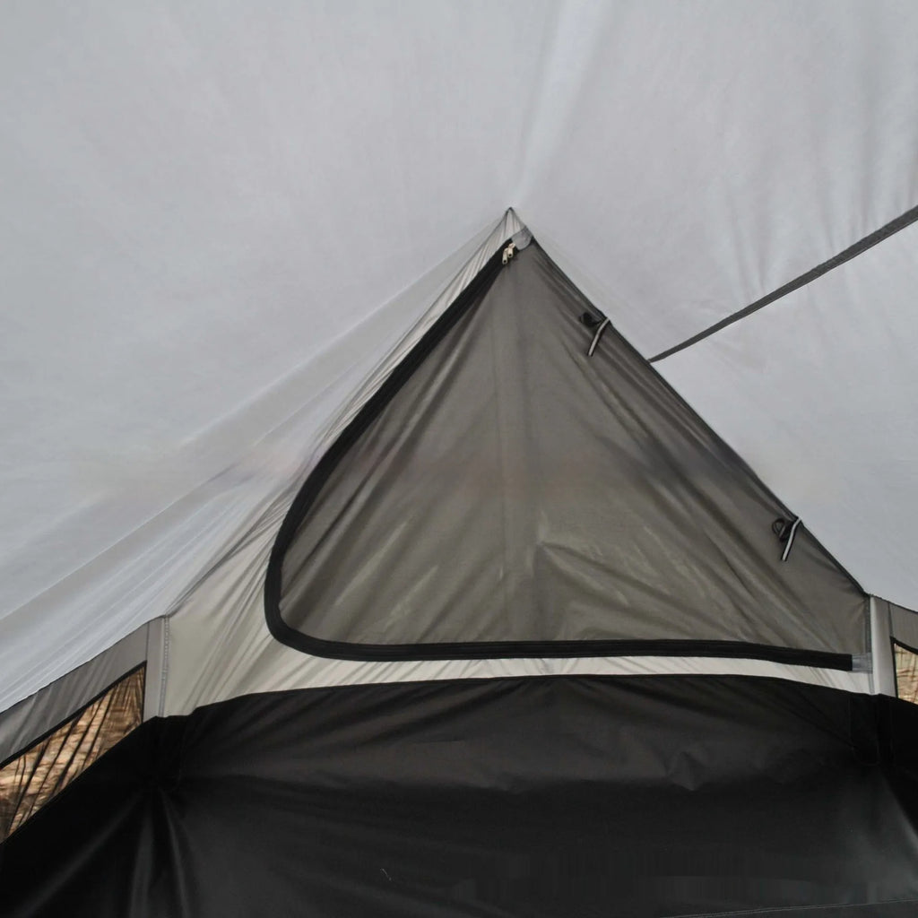 Brown or white A-line cabin tent pitched with trekking poles, showing spacious interior and waterproof fabric construction