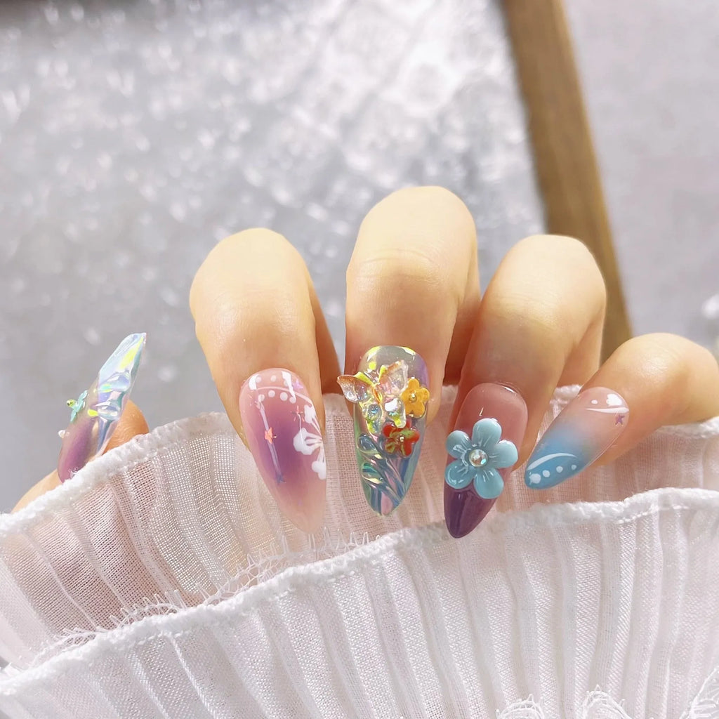 Handmade colourful manicure sculptures with floral butterfly designs for almond-shaped nails