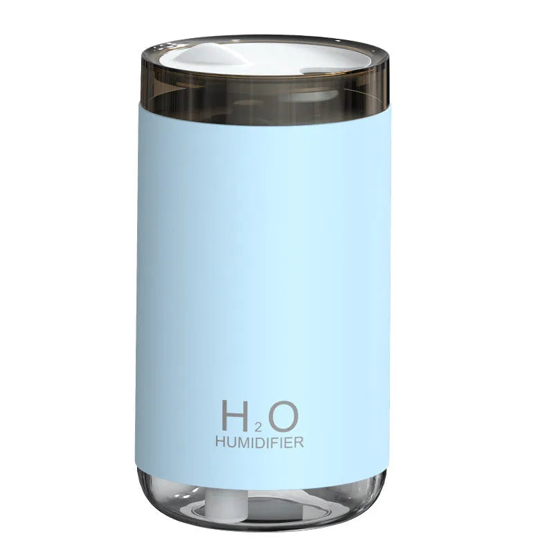 White jellyfish design USB humidifier with nano mist and warm night light on a desk