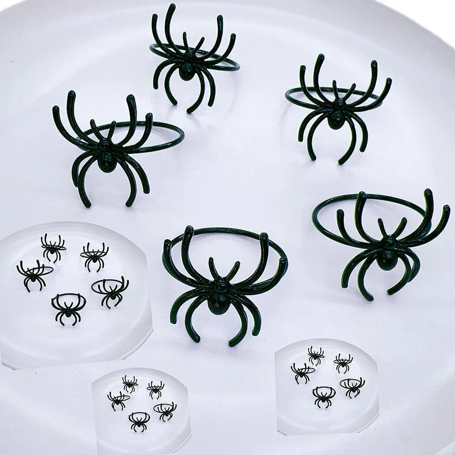 Six black spider design alloy napkin rings for Halloween table decoration measuring 5x4.5x4cm