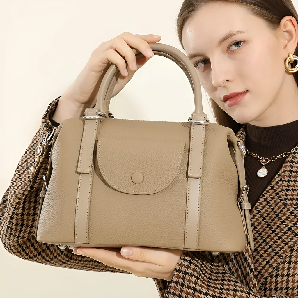 Genuine leather street trend ladies handbag with single shoulder strap in black, brown, or elephant grey.