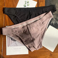 Men's solid colour cotton triangle briefs with a mid-waist waistband on a white background.