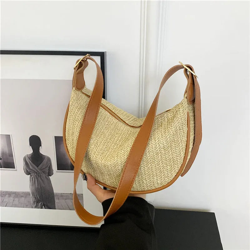 Knitted straw woven crossbody bag showing woven texture and internal organisation pockets