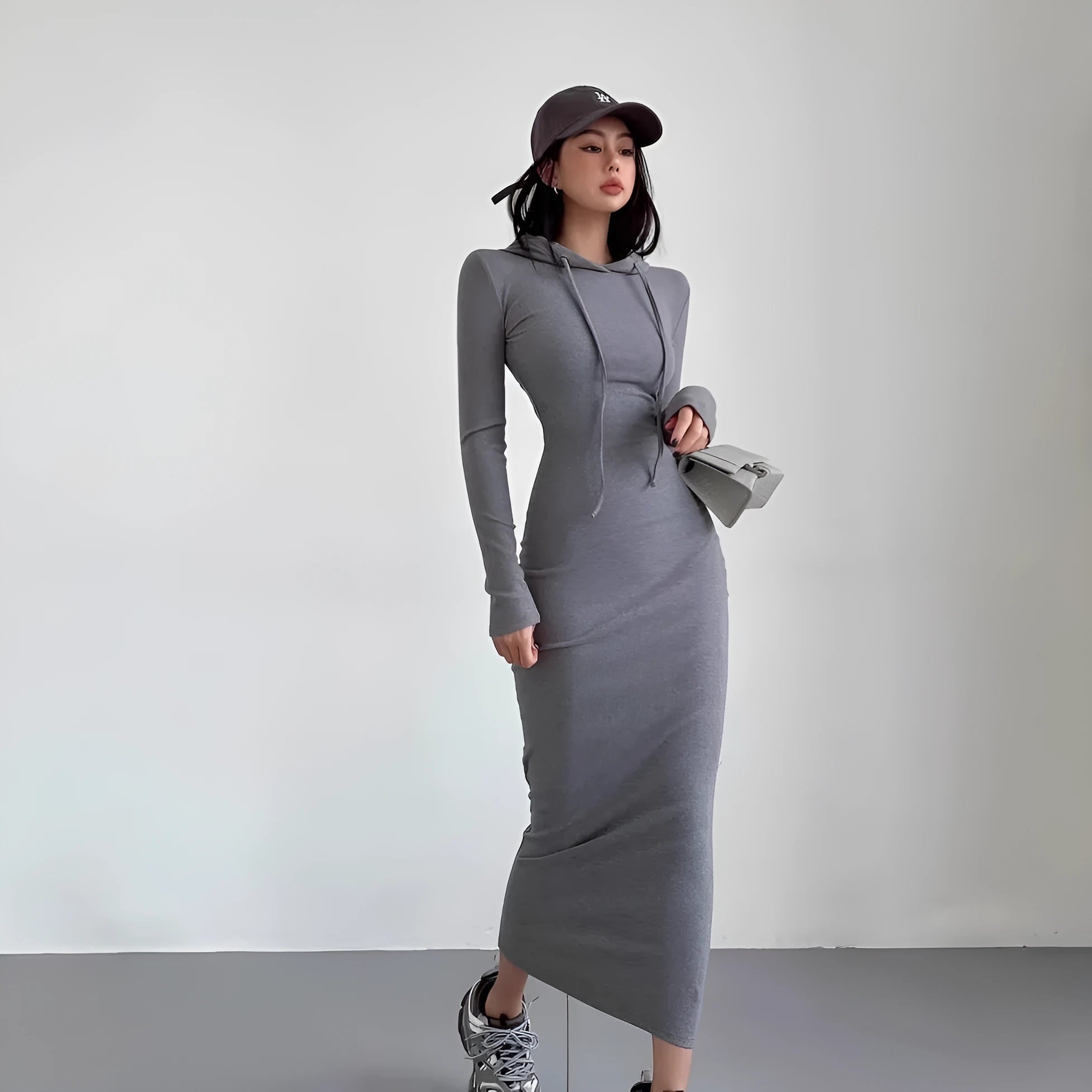 Women's grey hooded sheath dress with long sleeves and over-the-knee length in high-waist styling