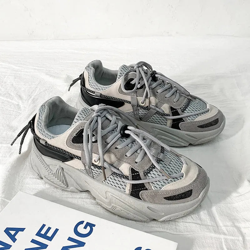 A pair of men's white Korean-style platform sports shoes with a lace-up front.